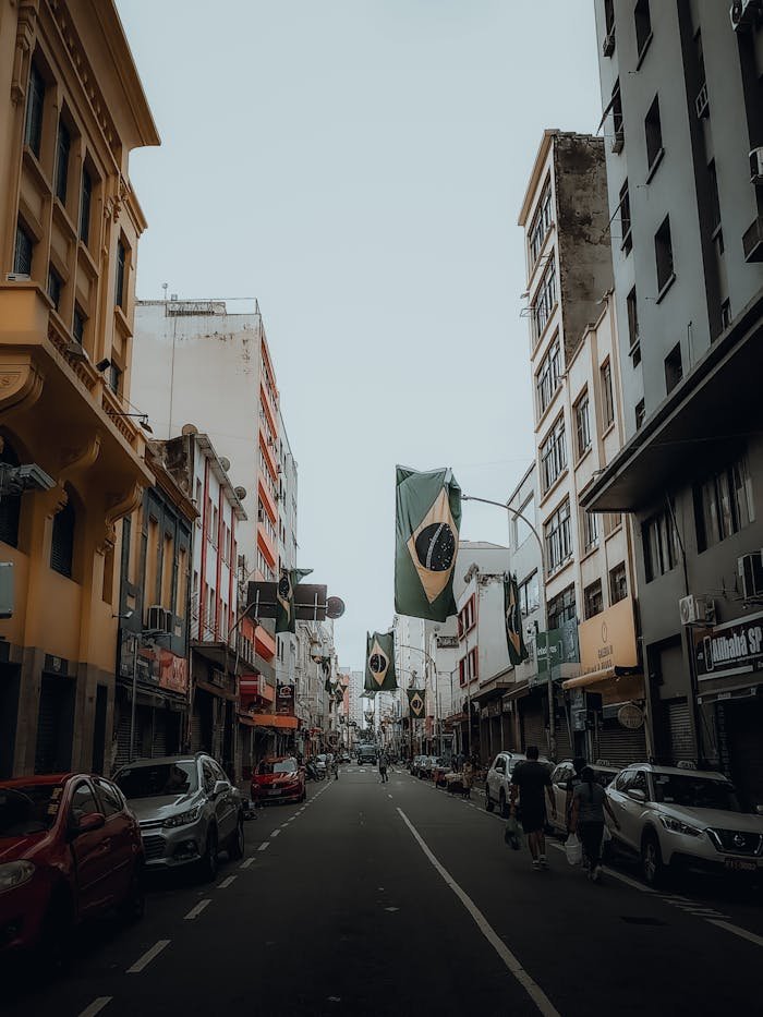 services-02 Dynamic street view in Brazil with flags and vibrant city life during the day.